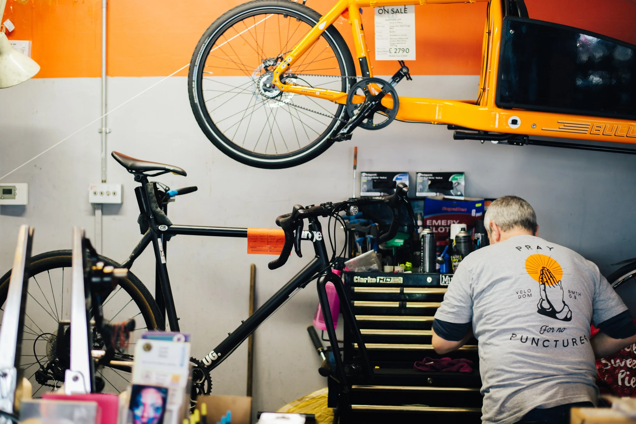 Bicycle maintenance tools and replacement components prepared for a workshop service